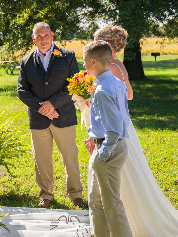 bride groom and son at the altar | outdoor fall wedding
